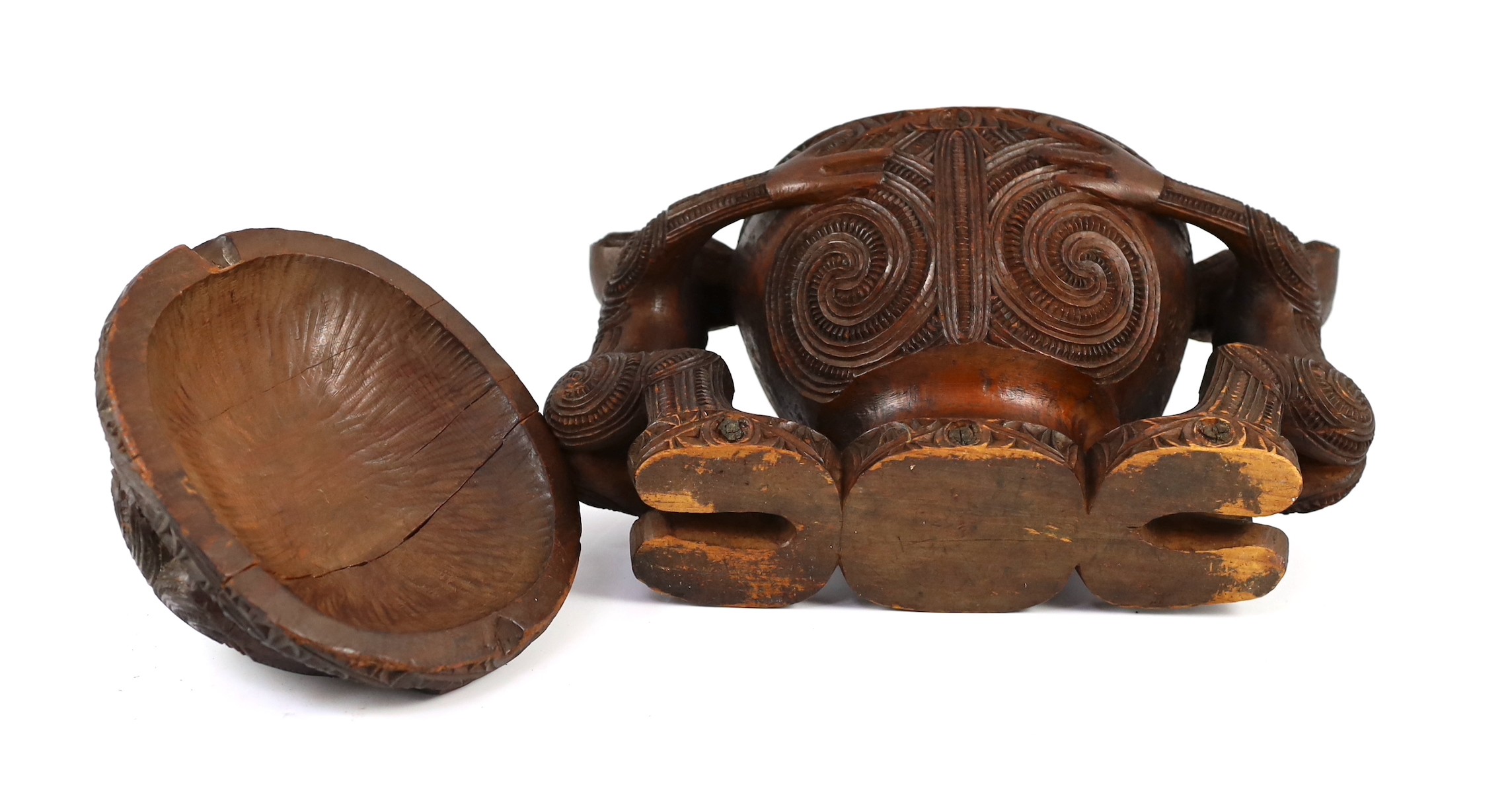 A Maori carved wood oblong bowl and cover, kumete, c.1880-1910, height 23cm length 31cm